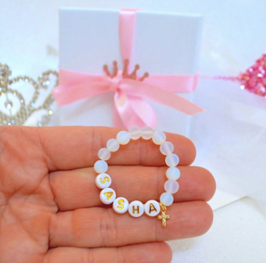 personalized sea opal baby bracelet with gold sparkly rhinestone cross, perfect baby shower gift