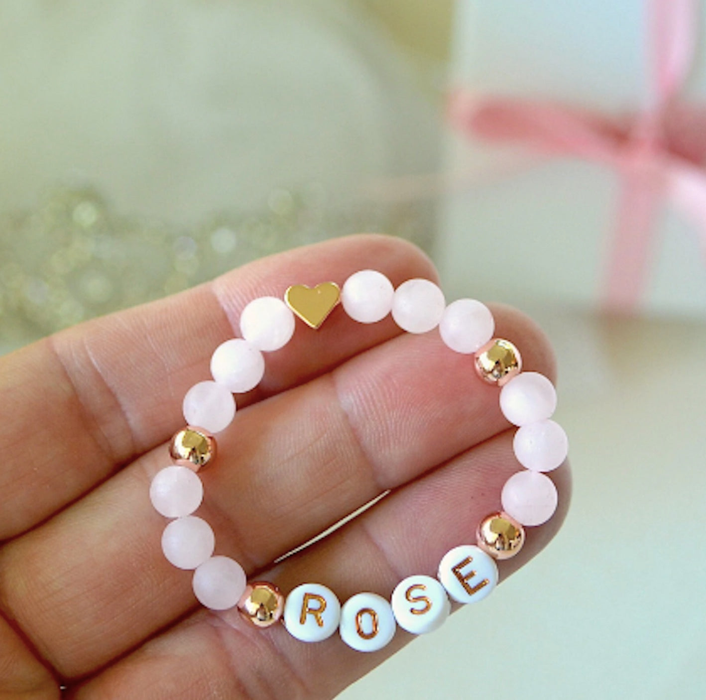 Personalized rose quartz baby bracelet with rose gold heart charm, custom newborn gift for baby girl, handmade baby shower jewelry