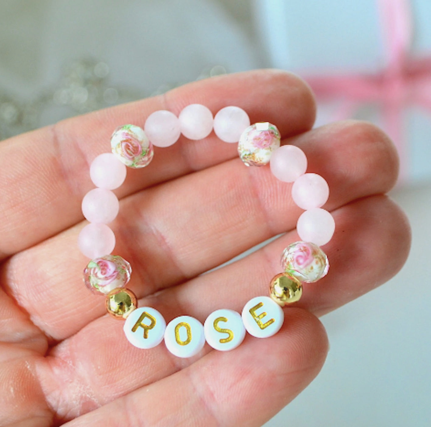 Personalized rose quartz beaded bracelet with sparkly crystal flower beads, perfect for baby girls or flower girls