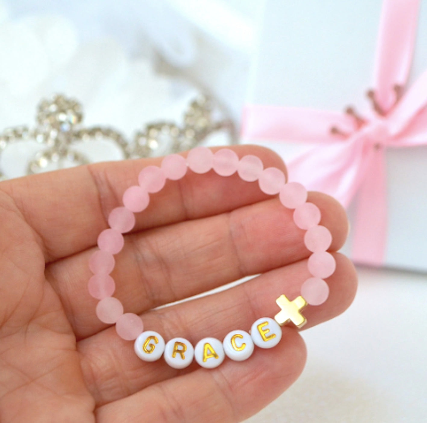 Personalized Rose Quartz Bracelet with gold cross charm – meaningful baptism, christening, or communion gift for girls, teens, and adults.