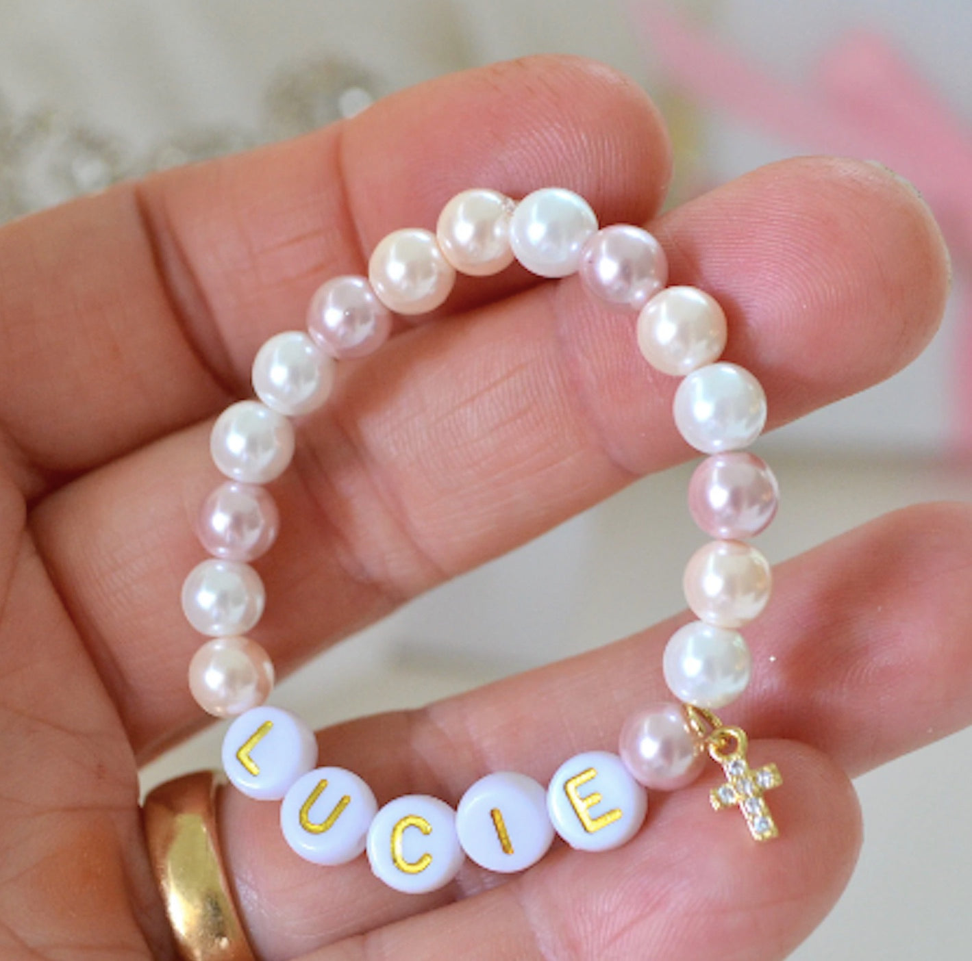 Personalized rhinestone cross bracelet with soft pink multi-colored pearls for baby, toddler, kids, and teens